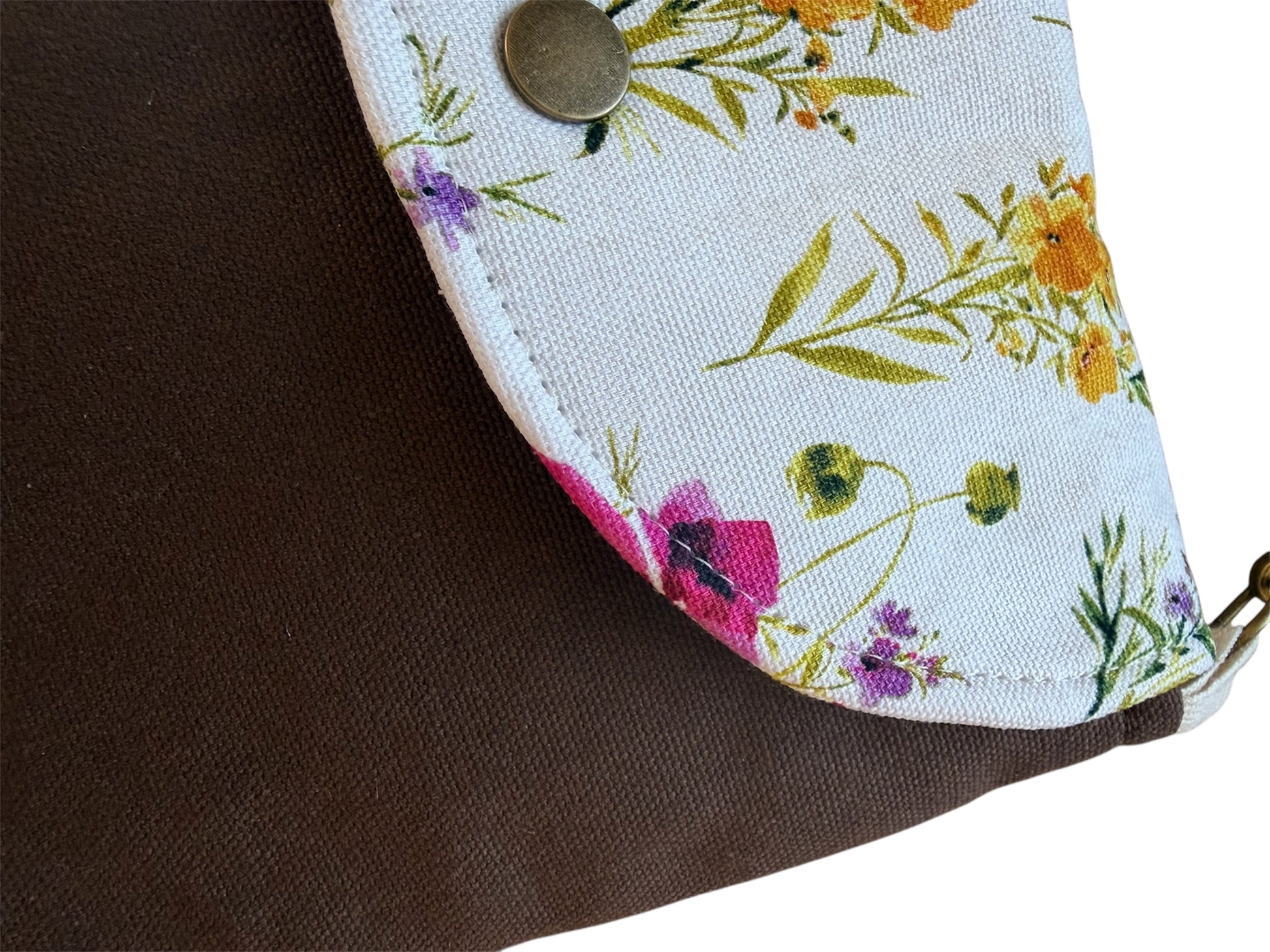 Top view of cocoa canvas tote bag with floral snap closure