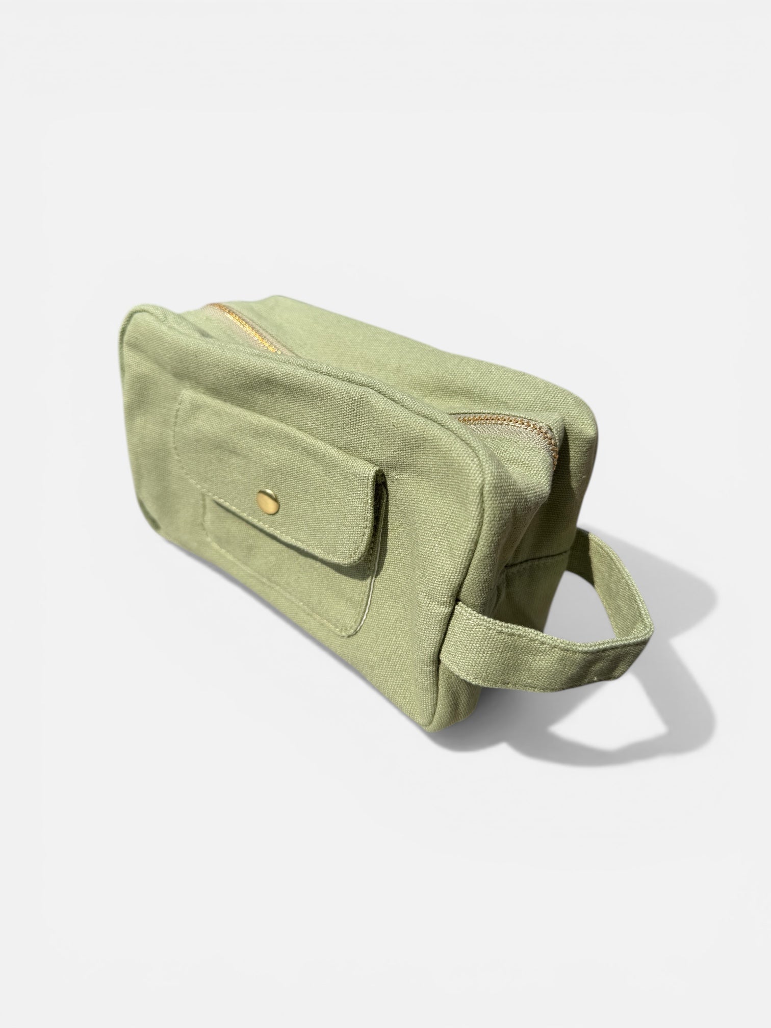 Olive green canvas makeup bag side view minimalist toiletry pouch