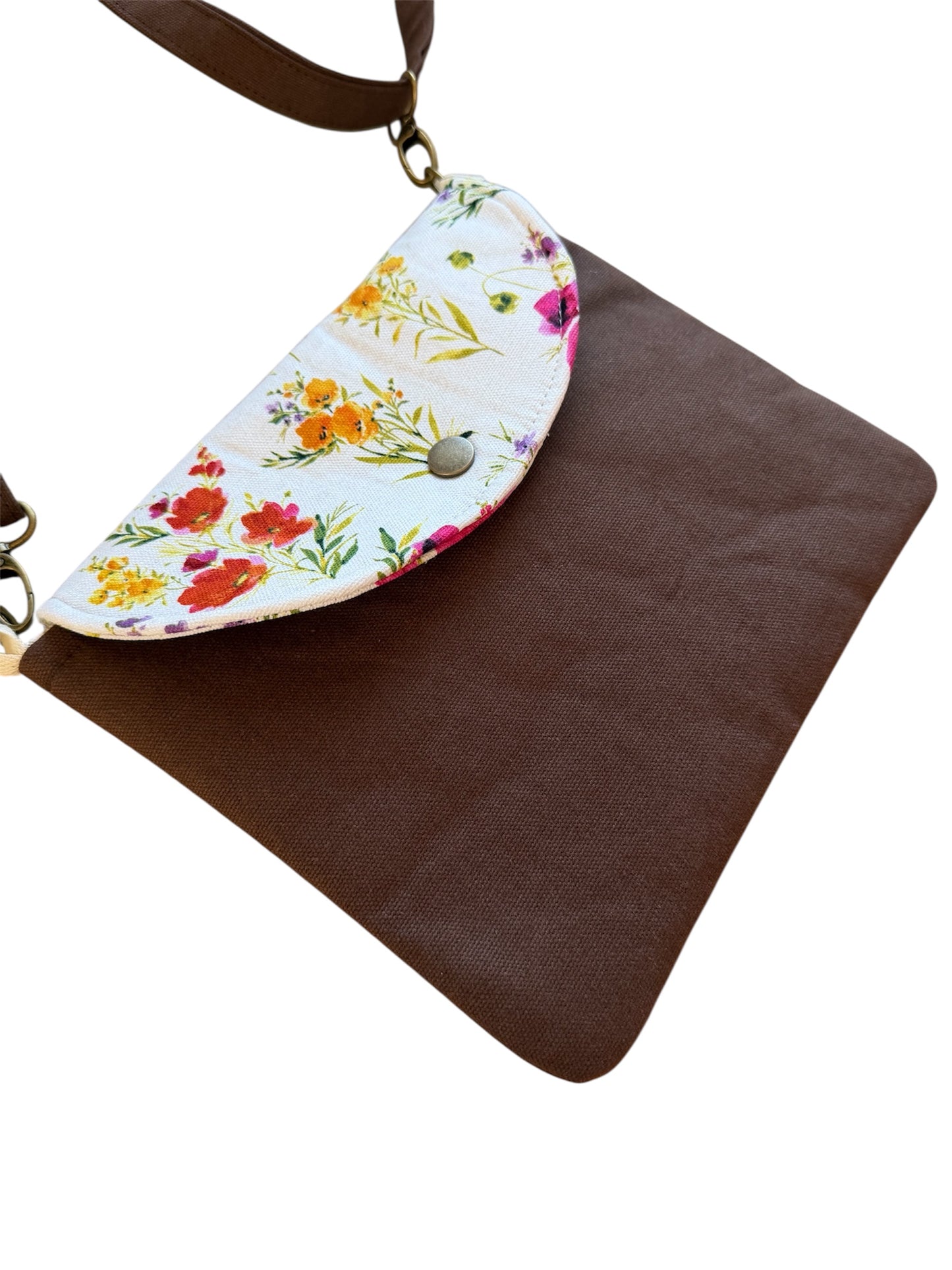 Cocoa canvas tote bag laid flat with floral snap detail