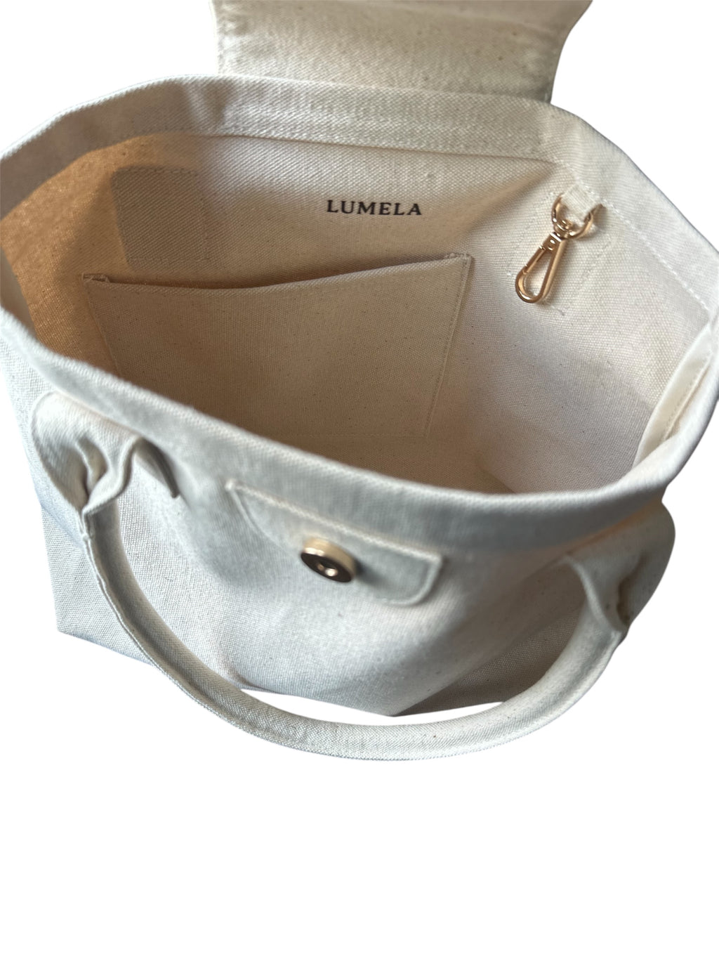 Minimalist canvas bag with inner pocket, key hook, and magnetic snap closure