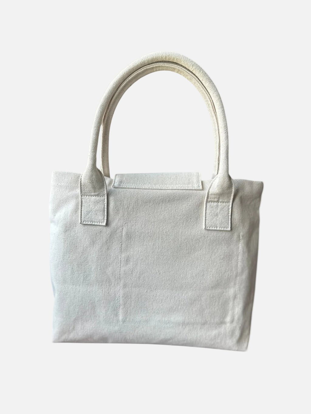 Minimalist white canvas tote bag with dual handles on white background