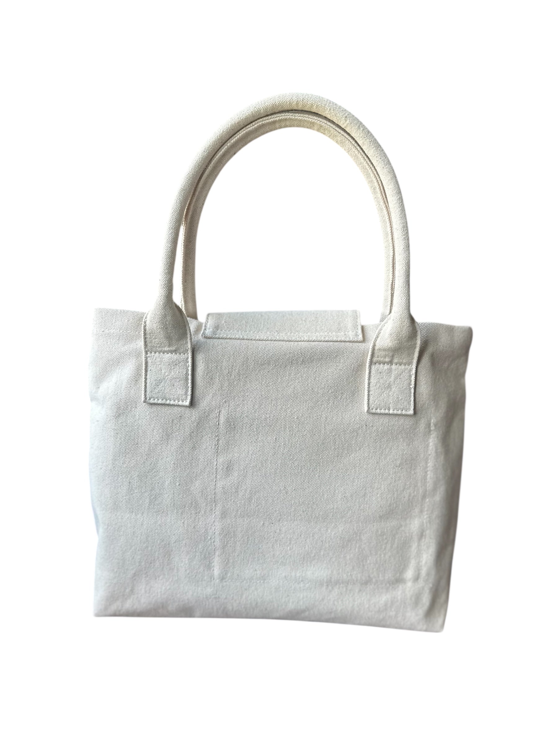 Minimalist white canvas tote bag with dual handles on white background