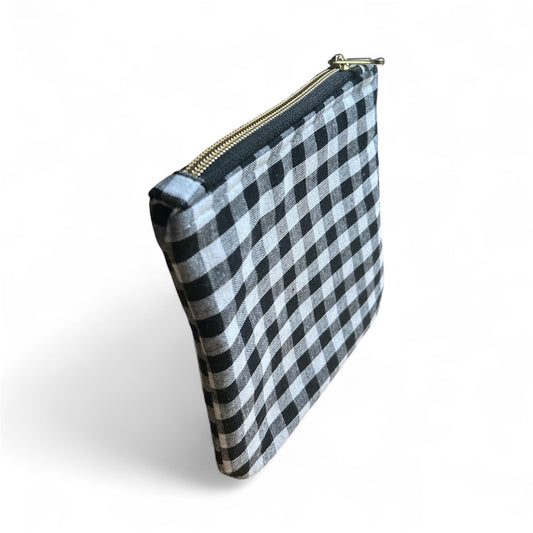 Black and white checkered canvas zipper pouch on white background