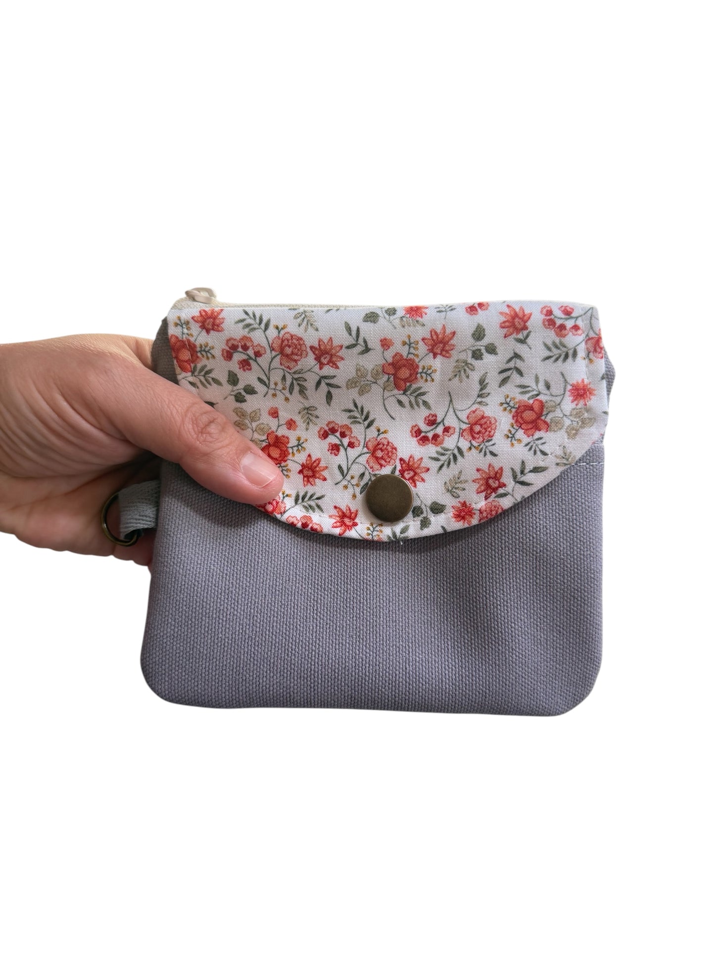 Florence gray floral keychain wallet held in hand