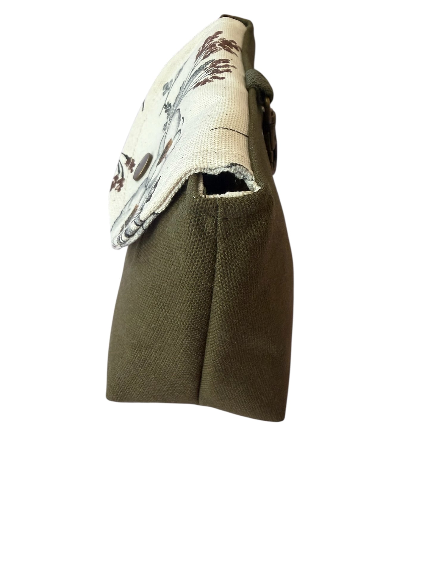 Side view of meadow canvas clip-on pouch showing shape