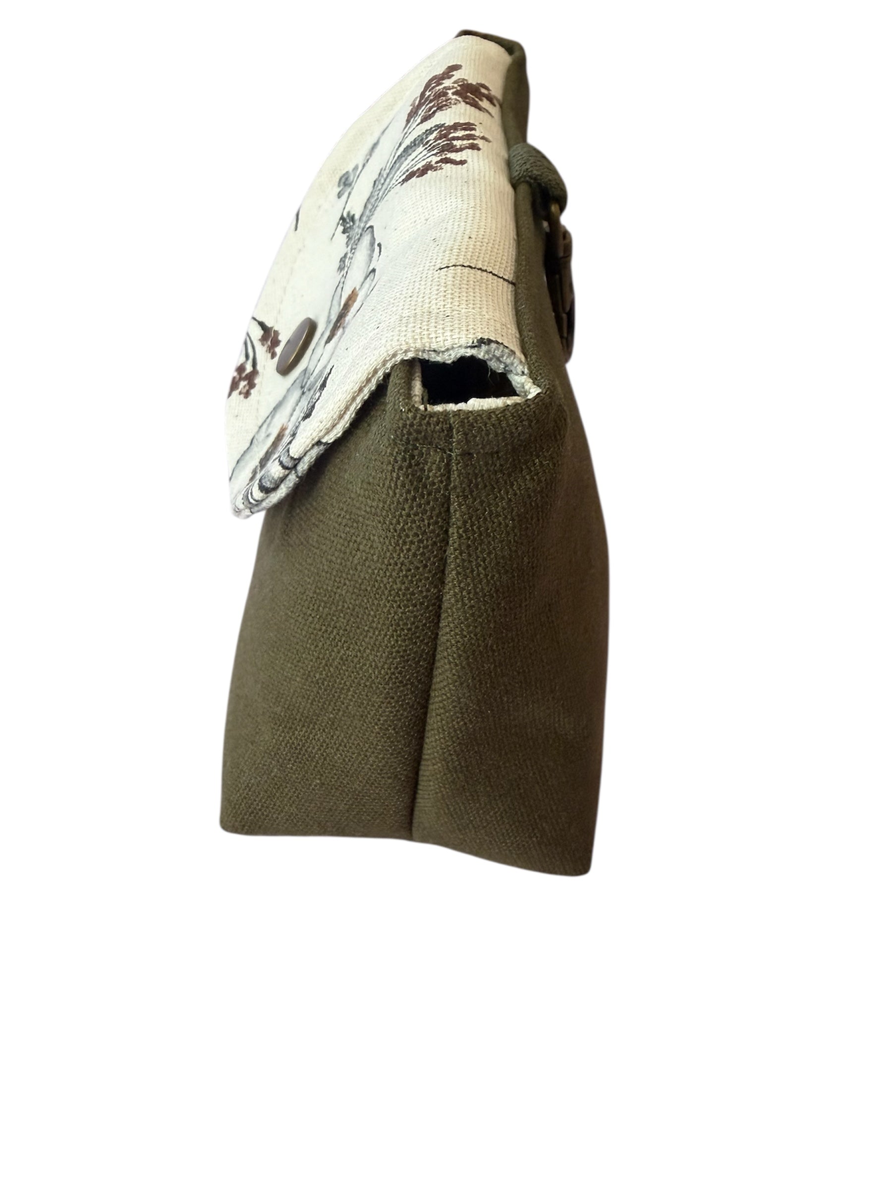 Side view of meadow canvas clip-on pouch showing shape
