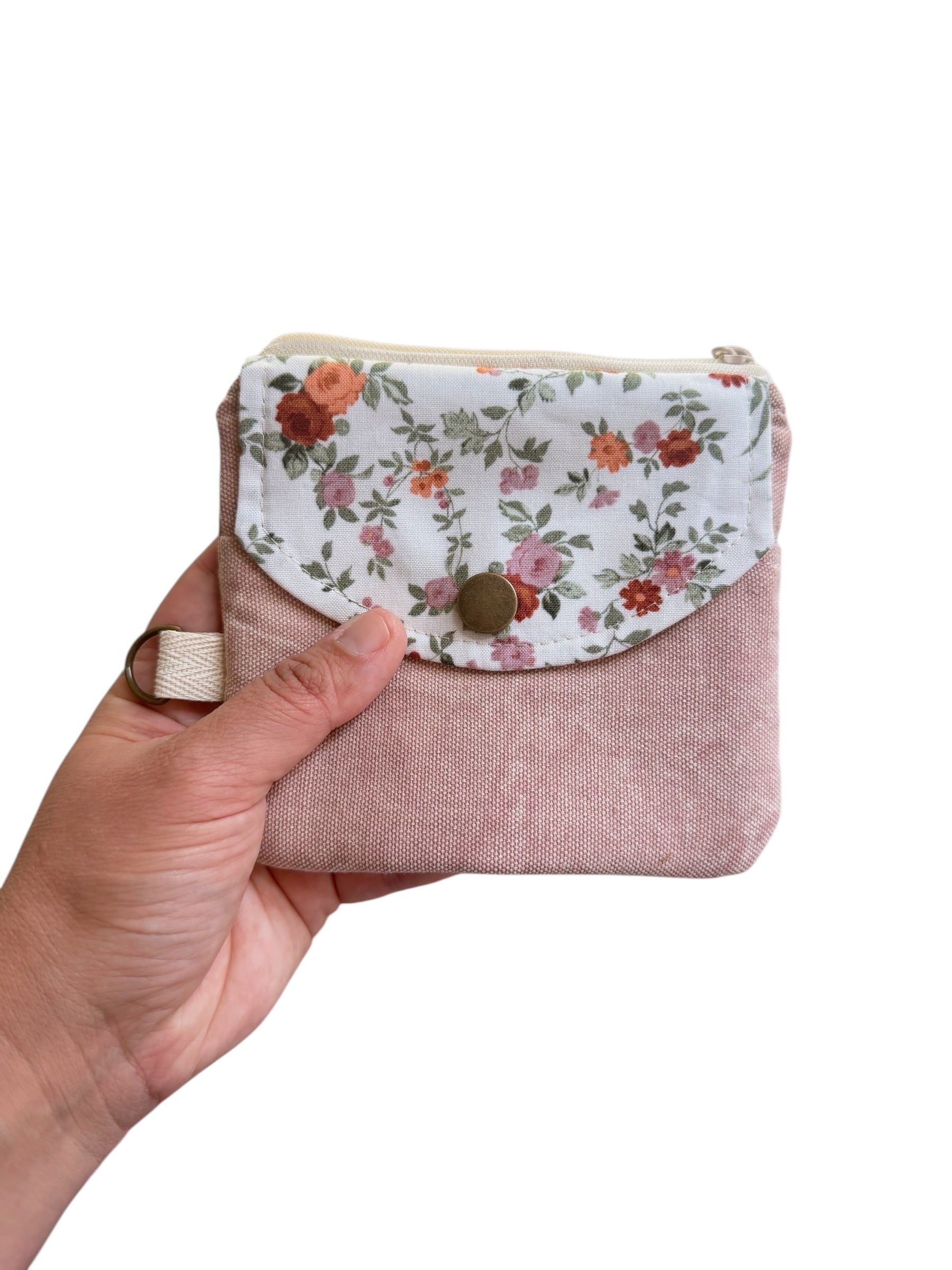 Florence pink floral keychain wallet held in hand