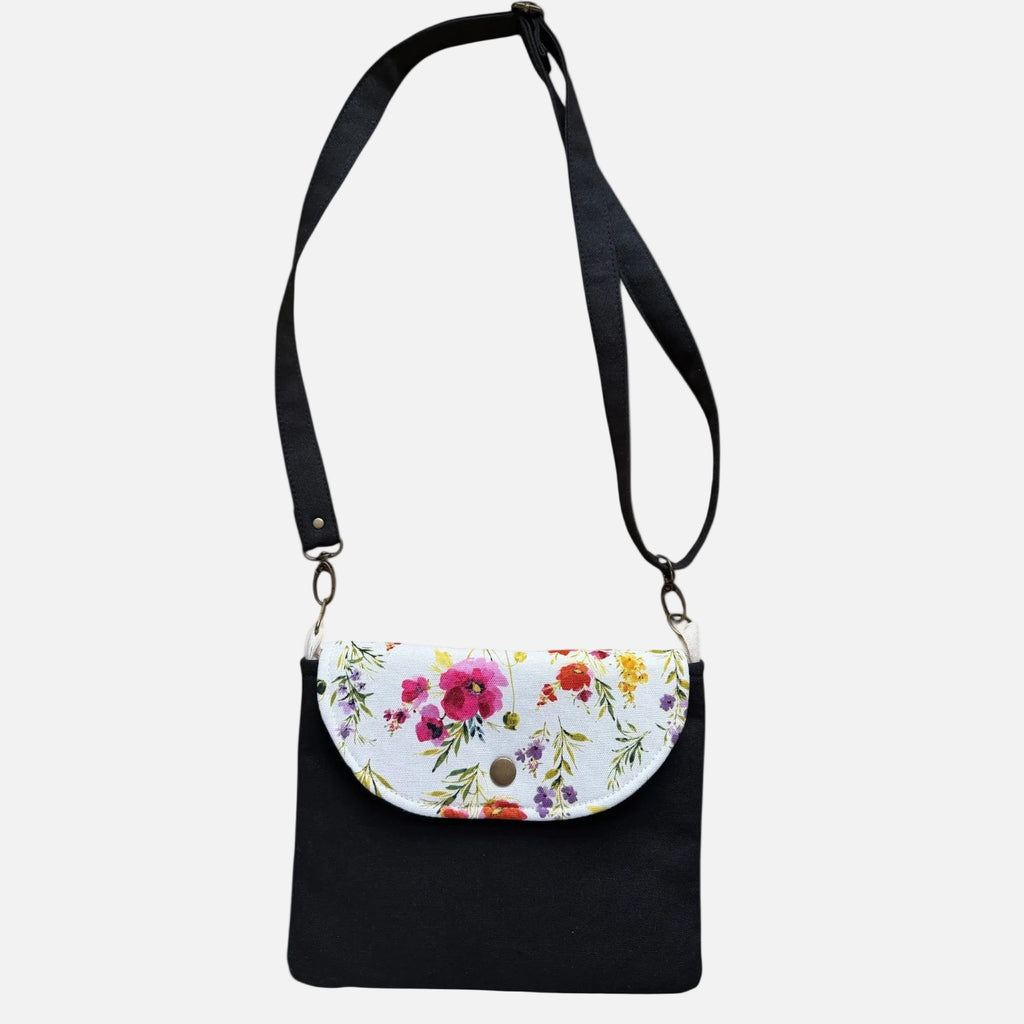 Black Floral canvas tote bag in soft spring tones on white background