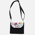 Black Floral canvas tote bag in soft spring tones on white background